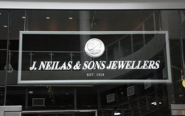 Backlit acrylic graphics storefront sign