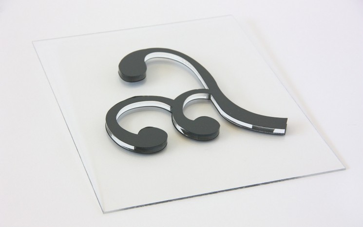 Laser cut acrylic with grey adhesive vinyl face movie set prop
