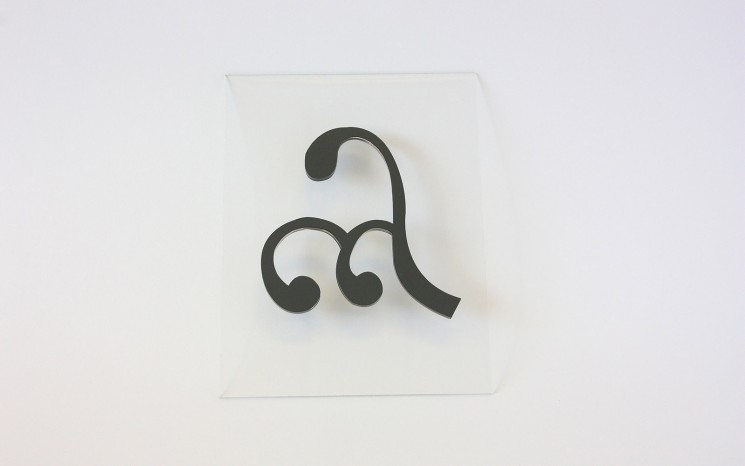 Laser cut acrylic with grey adhesive vinyl face movie set prop
