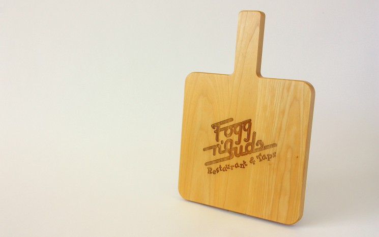 Custom made maple wood serving board with laser engraved logo
