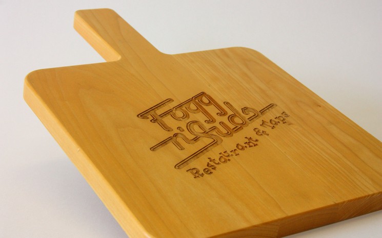 Custom made maple wood serving board with laser engraved logo