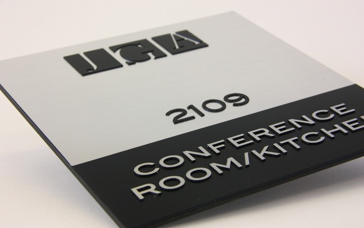 Raised lettering brushed aluminum wayfinder/directional sign