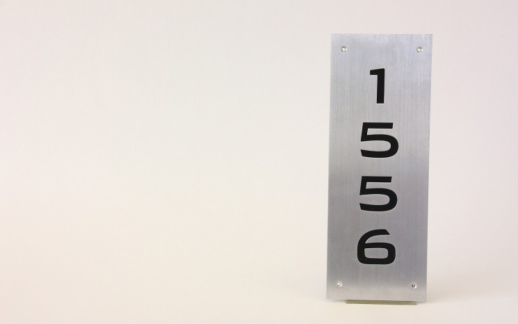 Engraved hand brushed satin aluminum wayfinder/directional sign