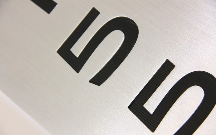 Engraved hand brushed satin aluminum wayfinder/directional sign