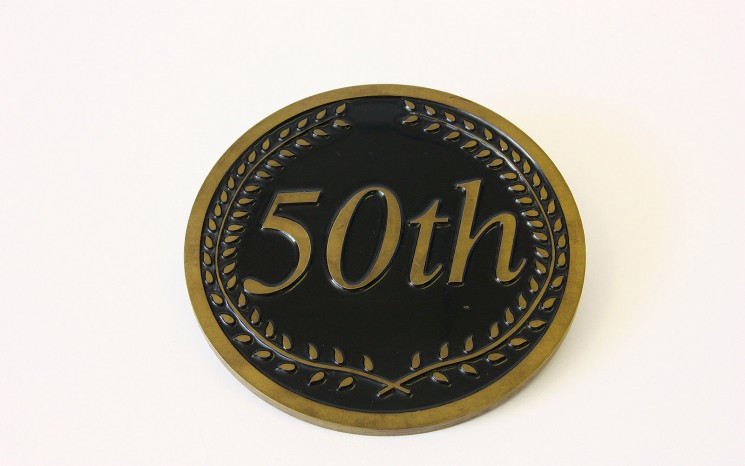 Engraved brass and back in-filled black award