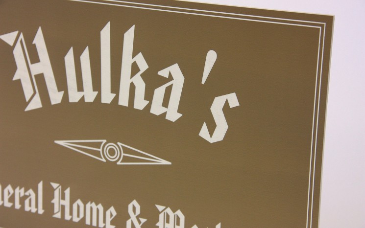 Laser engraved graphics business sign