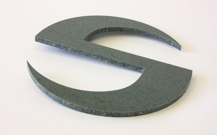 Routered Corian symbol