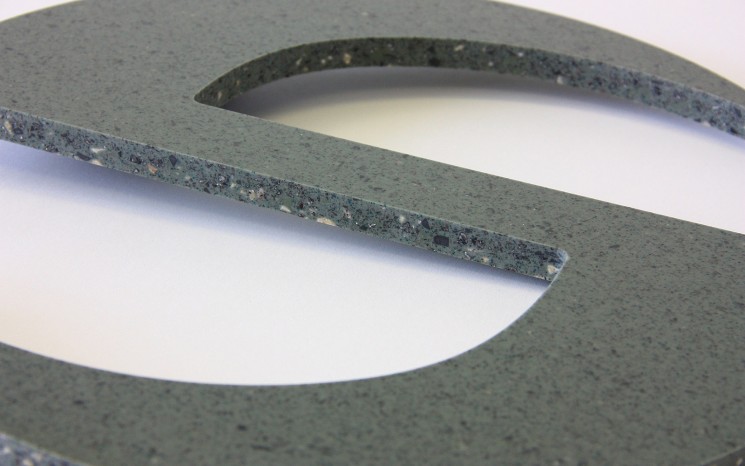 Routered Corian symbol