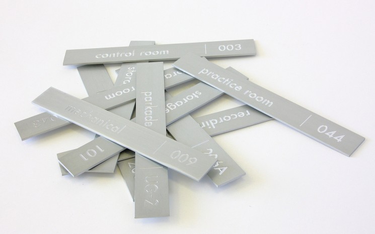 Engraved clear anodized aluminum wayfinder/directional signs