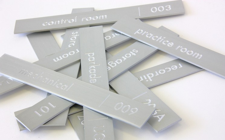 Engraved clear anodized aluminum wayfinder/directional signs