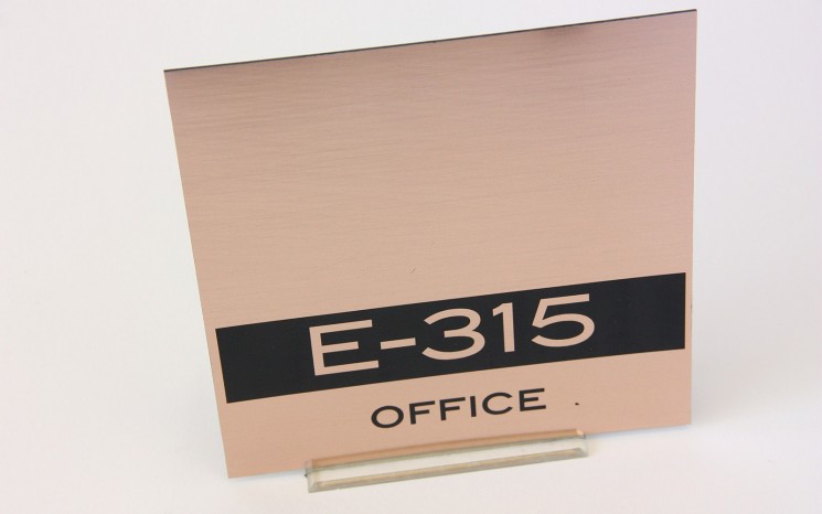Laser engraved brushed copper plastic wayfinder/directional sign