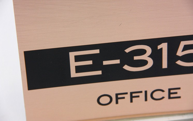 Laser engraved brushed copper plastic wayfinder/directional sign