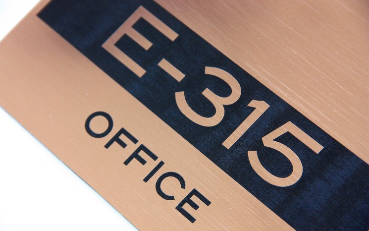 Laser engraved brushed copper plastic wayfinder/directional sign