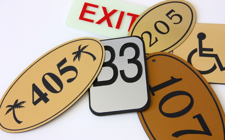 Engraved plastic and brass wayfinder/directional signs