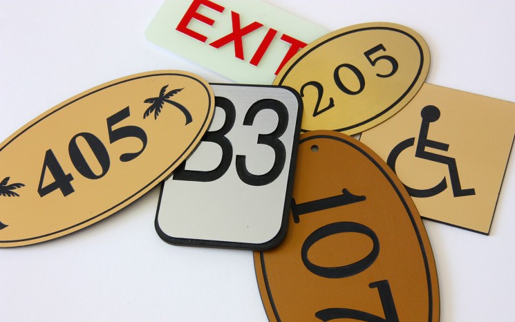 Engraved plastic and brass wayfinder/directional signs