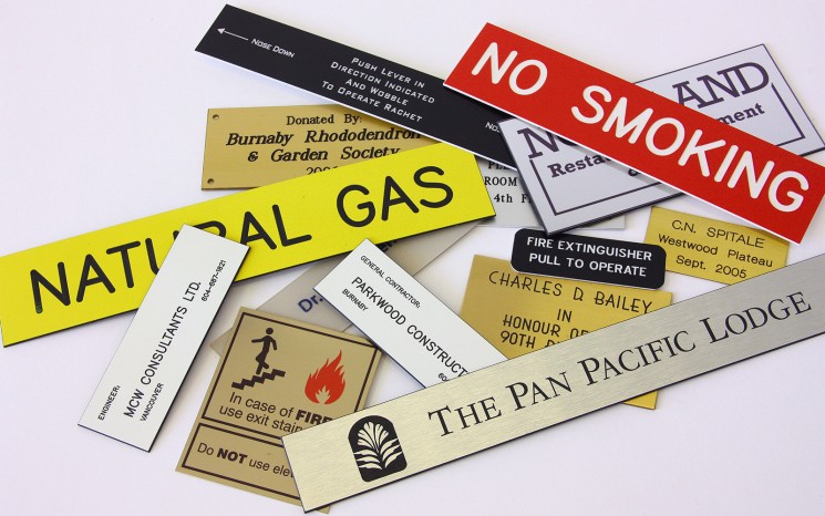 Engraved plastic and brass wayfinder/directional signs