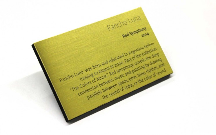 Brass plaque with burnished and blackened text on a 1/4″ black sintra backer