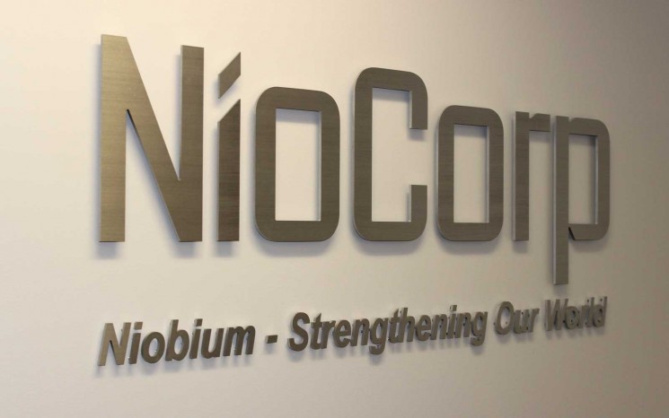 Reception area sign on brushed aluminum