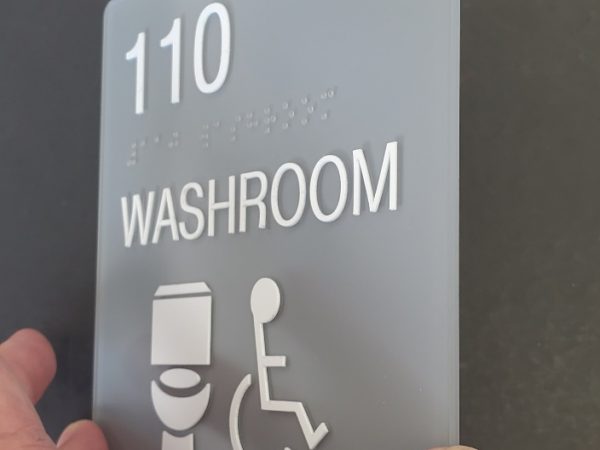 Custom Schoolfit Sign 8 x 8 washroom with raised tactile ADA and clear braille Toilet - side