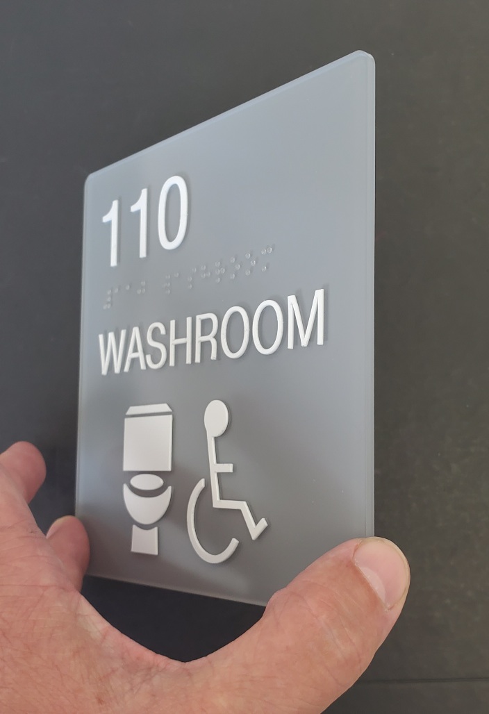 Custom Schoolfit Sign 8 x 8 washroom with raised tactile ADA and clear braille Toilet - side