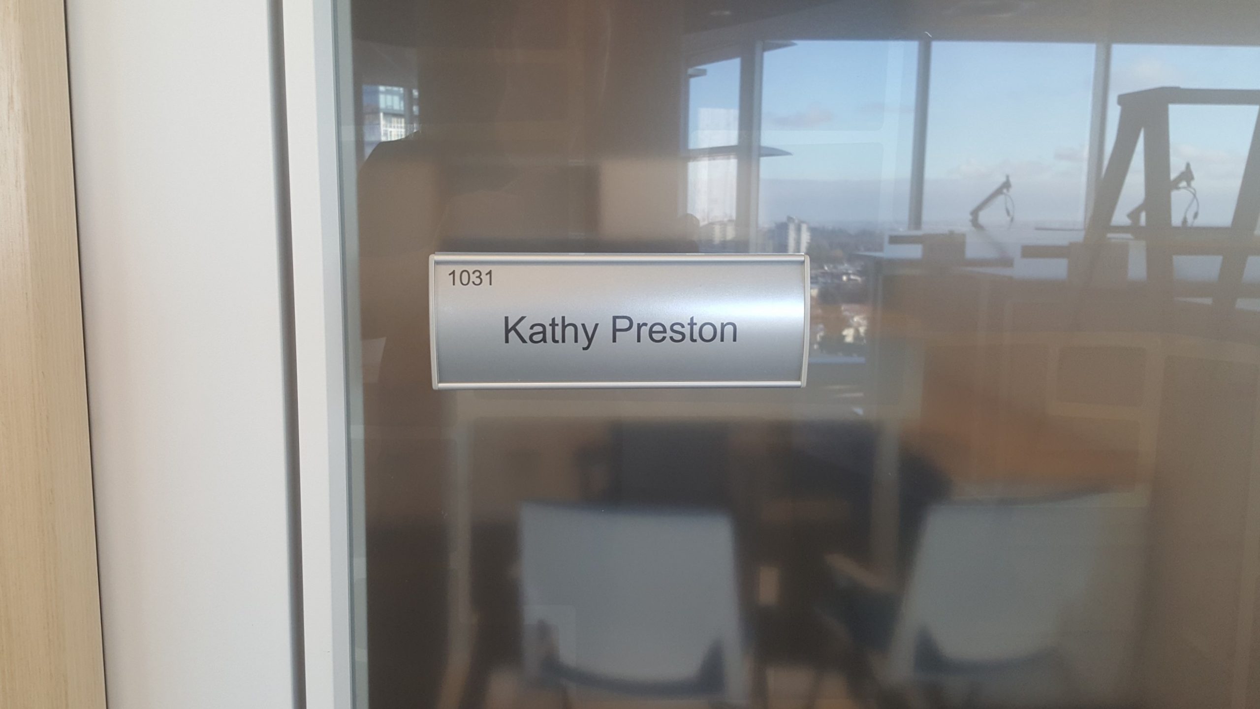 Changeable VSC100-8.5L Curved Office nameplate installed Kathy